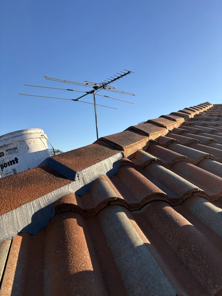 Ridge capping re-secured and sealed